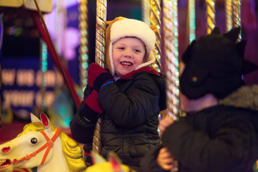 Boy on Carousel at Lanterns and Light