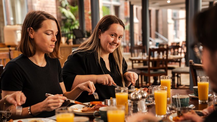 People Eating At A Dinner Table The Oakfield