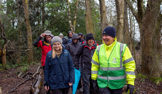 Wildlife Champions People Walking Through The Woods