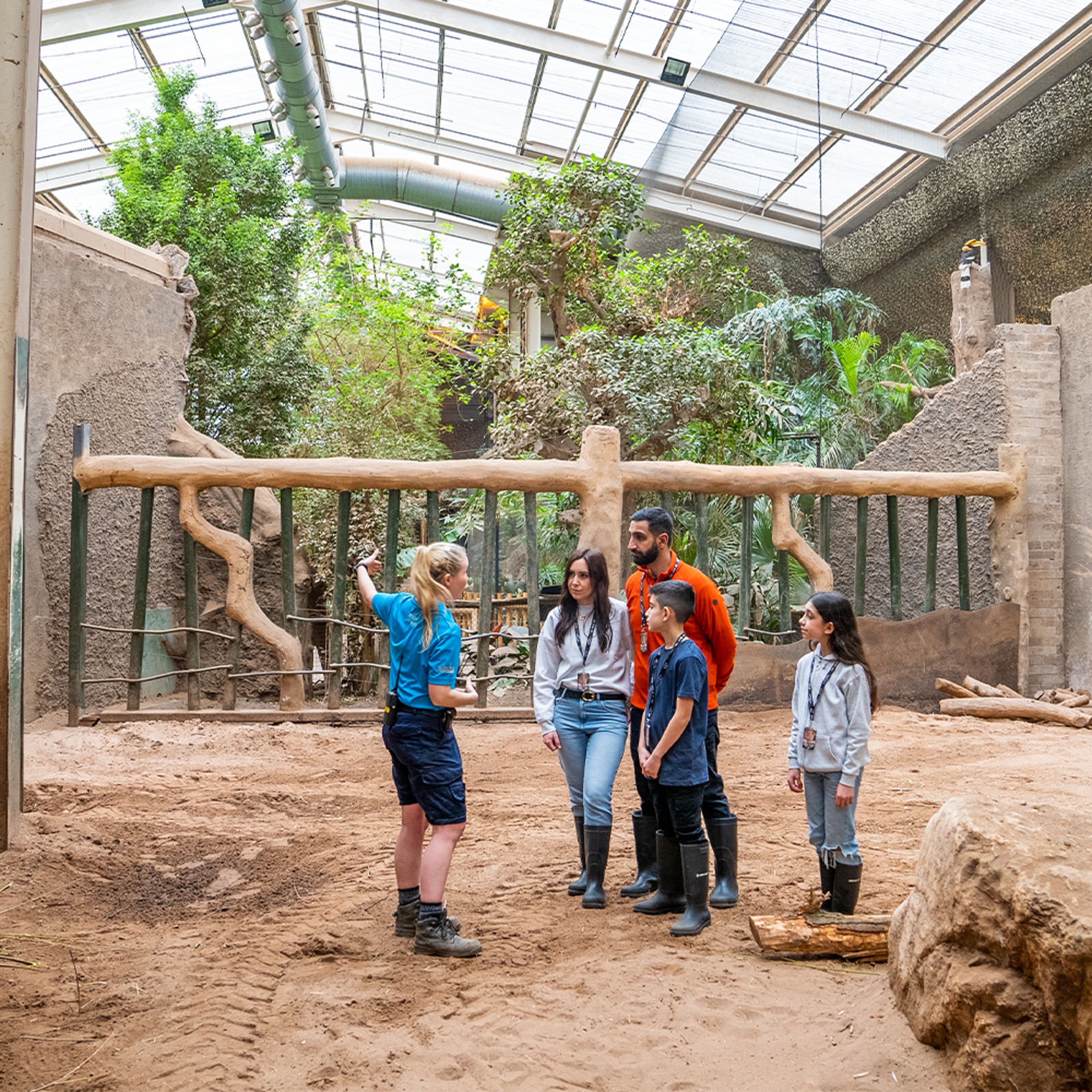 A family of experience participants being shown around the Elephant House